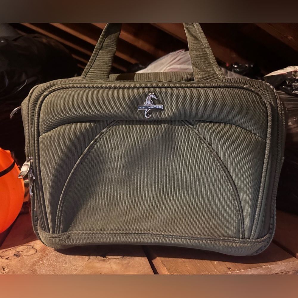Dark Green squared suitcase.